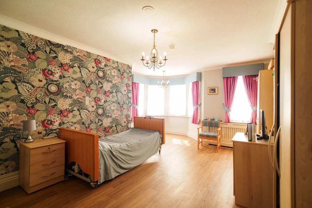Interior - A bright and welcoming bedroom with a warm, homely feel