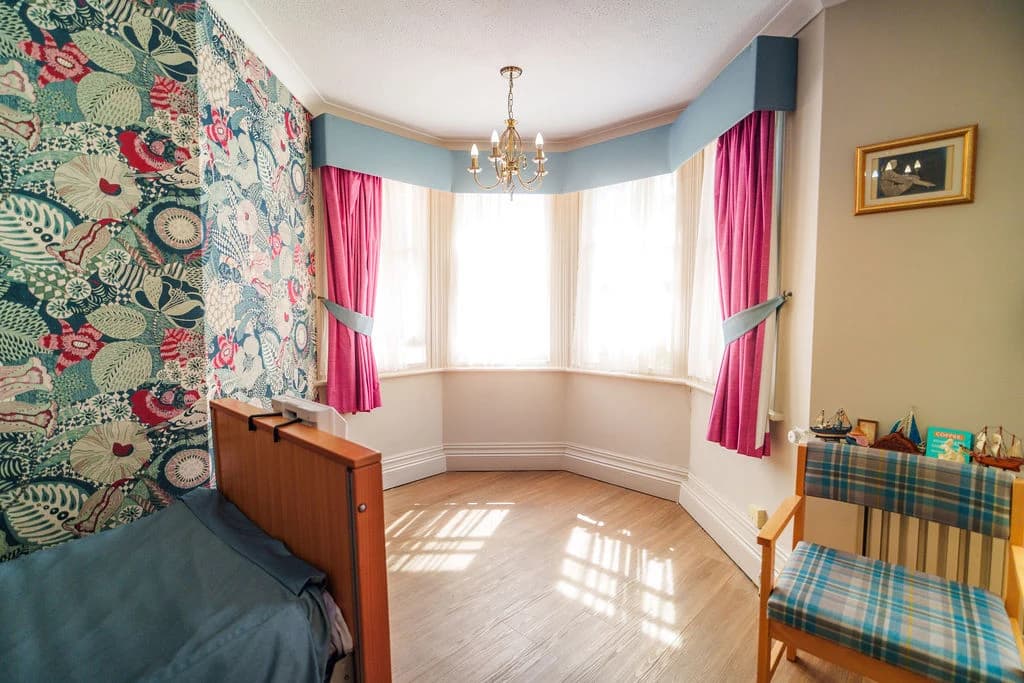 Interior - A bright and peaceful bedroom with a warm, homely atmosphere